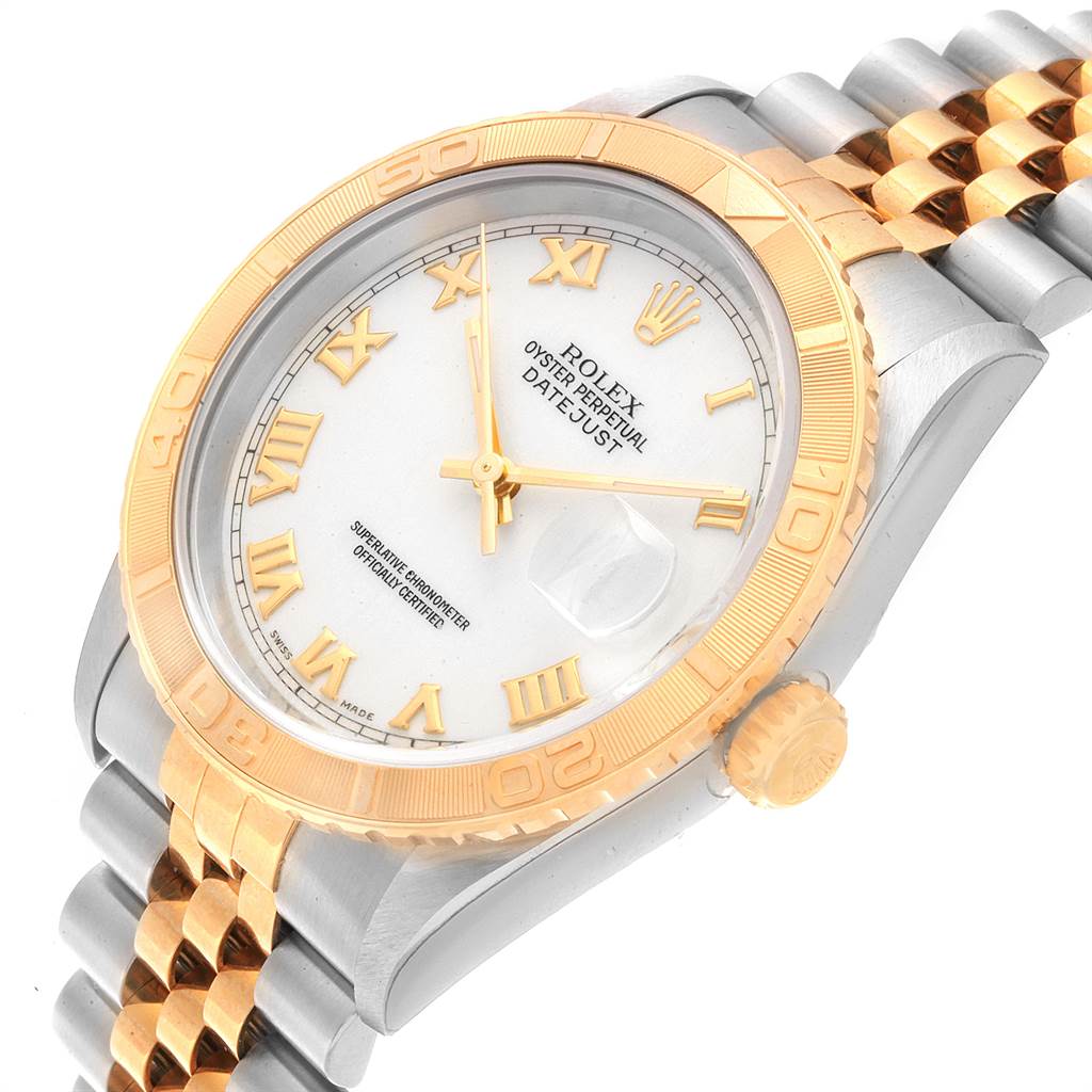 This image shows a Rolex Turn-o-Graph 16263 Men
s Steel and Gold (two tone) White Dial 16263 Men
s Steel and Gold (two tone) White Dial watch, at a slightly tilted angle, featuring its dial, case, bezel, and part of its bracelet.