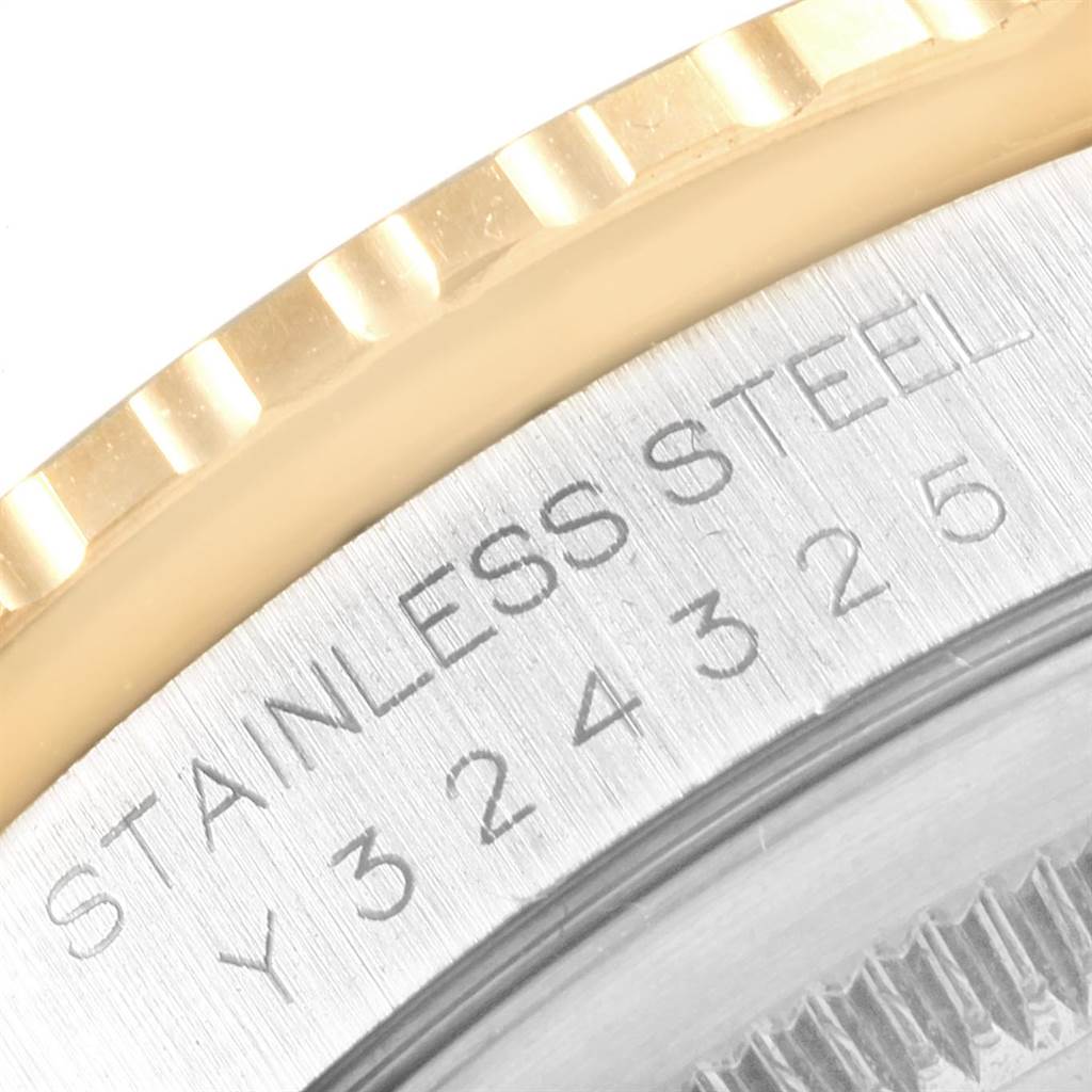 This image shows a close-up of the Rolex Turn-o-Graph 16263 Men
s Steel and Gold (two tone) White Dial 16263 Men
s Steel and Gold (two tone) White Dial watch bezel and part of the case back with stainless steel and serial number engraving.