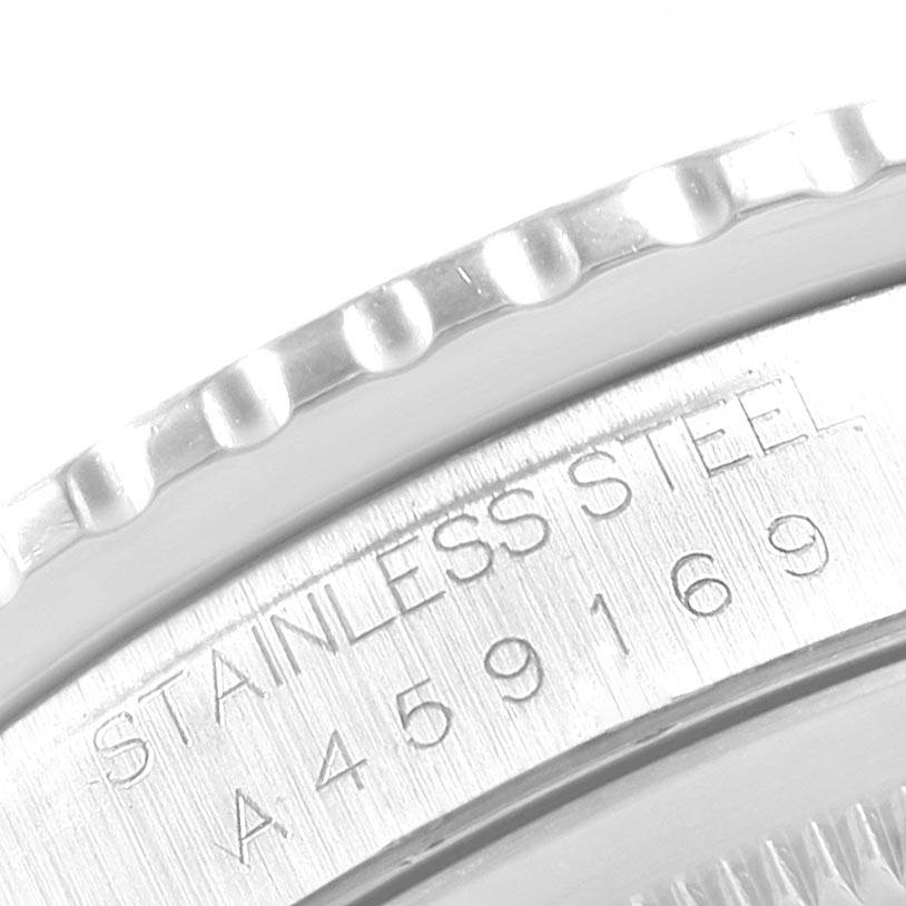 This image shows a close-up of the stainless steel bezel and engraving on a Rolex Turn-o-Graph 16264 Men
s Stainless Steel Silver Dial 16264 Men
s Stainless Steel Silver Dial watch.