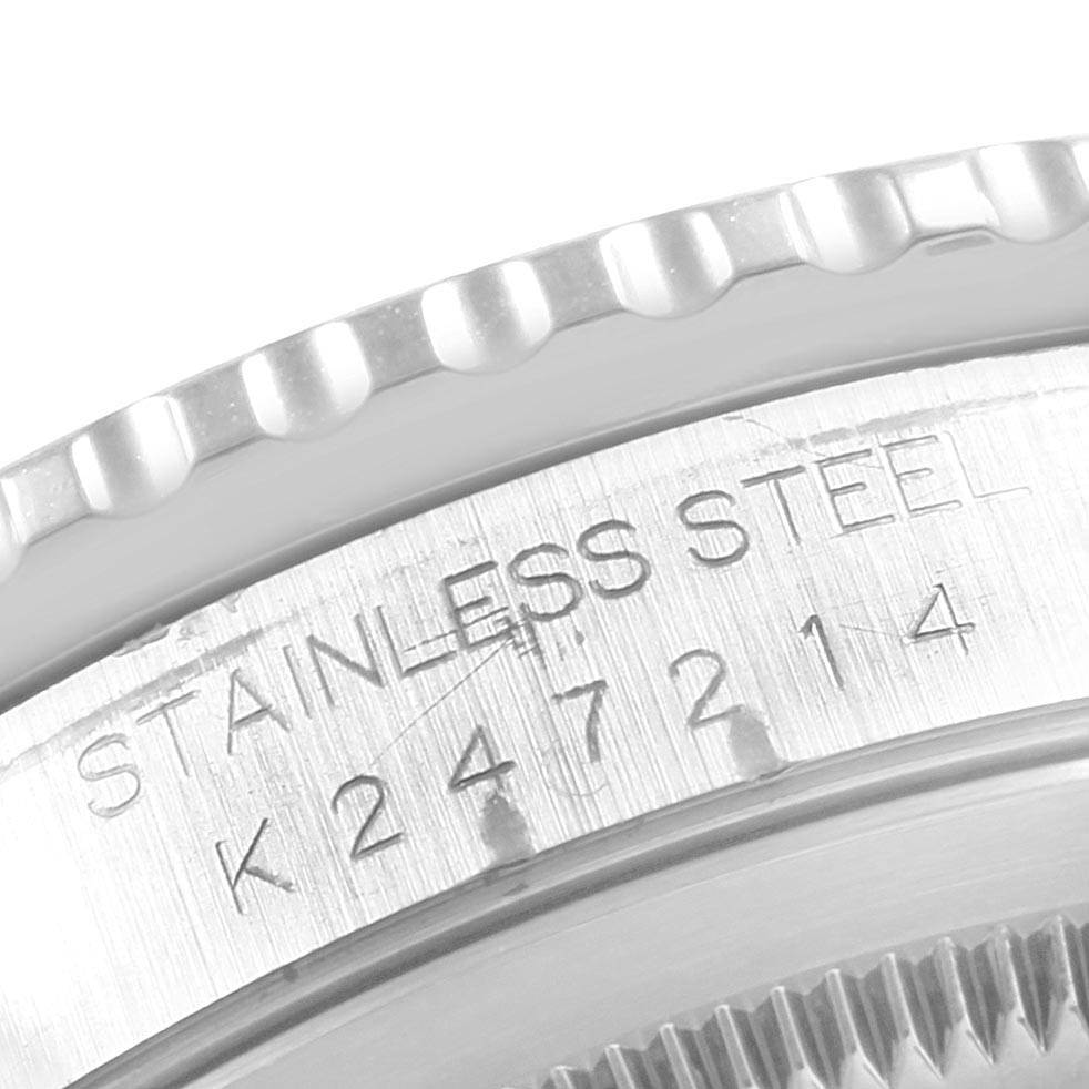This image shows the stainless steel bezel and engraved serial number of a Rolex Turn-o-Graph 16264 Men
s Stainless Steel Silver Dial 16264 Men
s Stainless Steel Silver Dial watch.