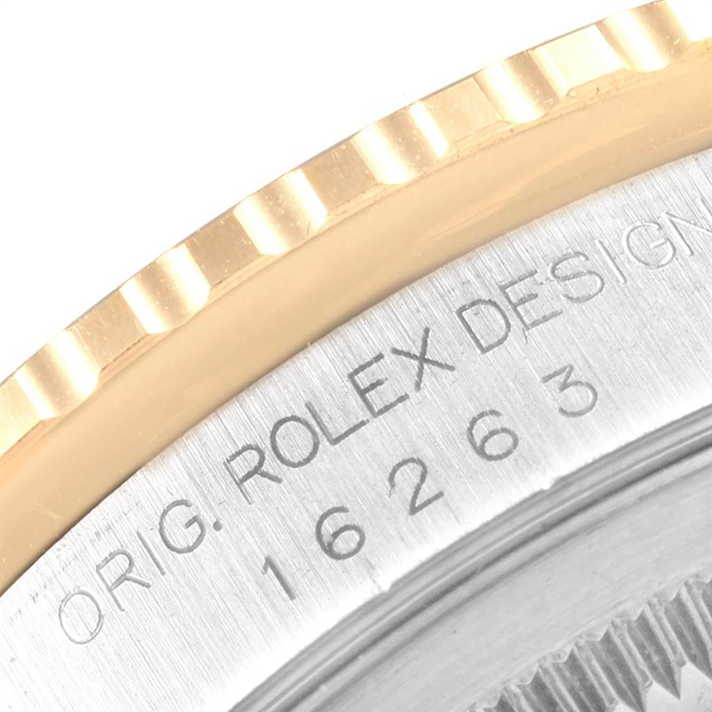 This close-up image shows the engraved case and part of the fluted bezel of the Rolex Turn-o-Graph 16263 Men
s Steel and Gold (two tone) White Dial 16263 Men
s Steel and Gold (two tone) White Dial watch.