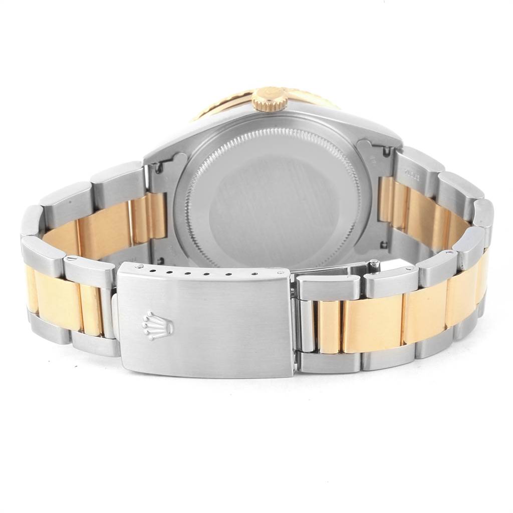 The image shows the back view of a Rolex Turn-o-Graph 16263 Men
s Steel and Gold (two tone) Champagne Dial 16263 Men
s Steel and Gold (two tone) Champagne Dial watch, highlighting the case, crown, and two-tone bracelet.