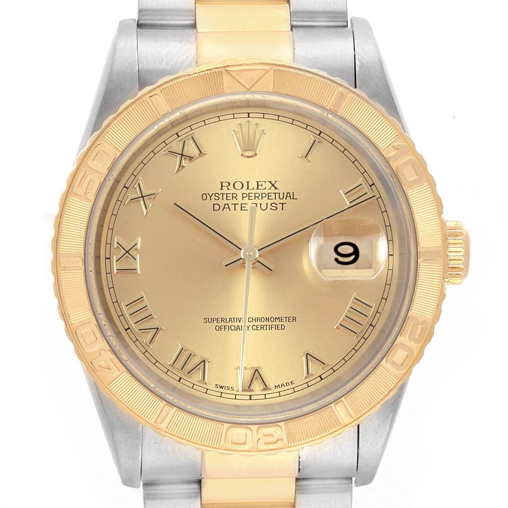 The image shows a close-up, front view of a Rolex Turn-o-Graph 16263 Men
s Steel and Gold (two tone) Champagne Dial 16263 Men
s Steel and Gold (two tone) Champagne Dial watch, highlighting its dial, bezel, and part of the bracelet.