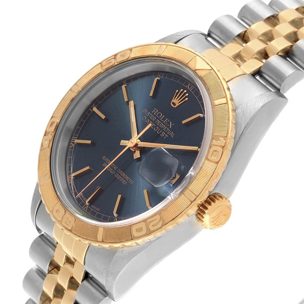 The image shows a Rolex Turn-o-Graph 16263 Men's Steel and Gold (two tone) Blue Dial 16263 Men's Steel and Gold (two tone) Blue Dial watch at an angle highlighting its two-tone bracelet, gold bezel, and blue dial with a date window.
