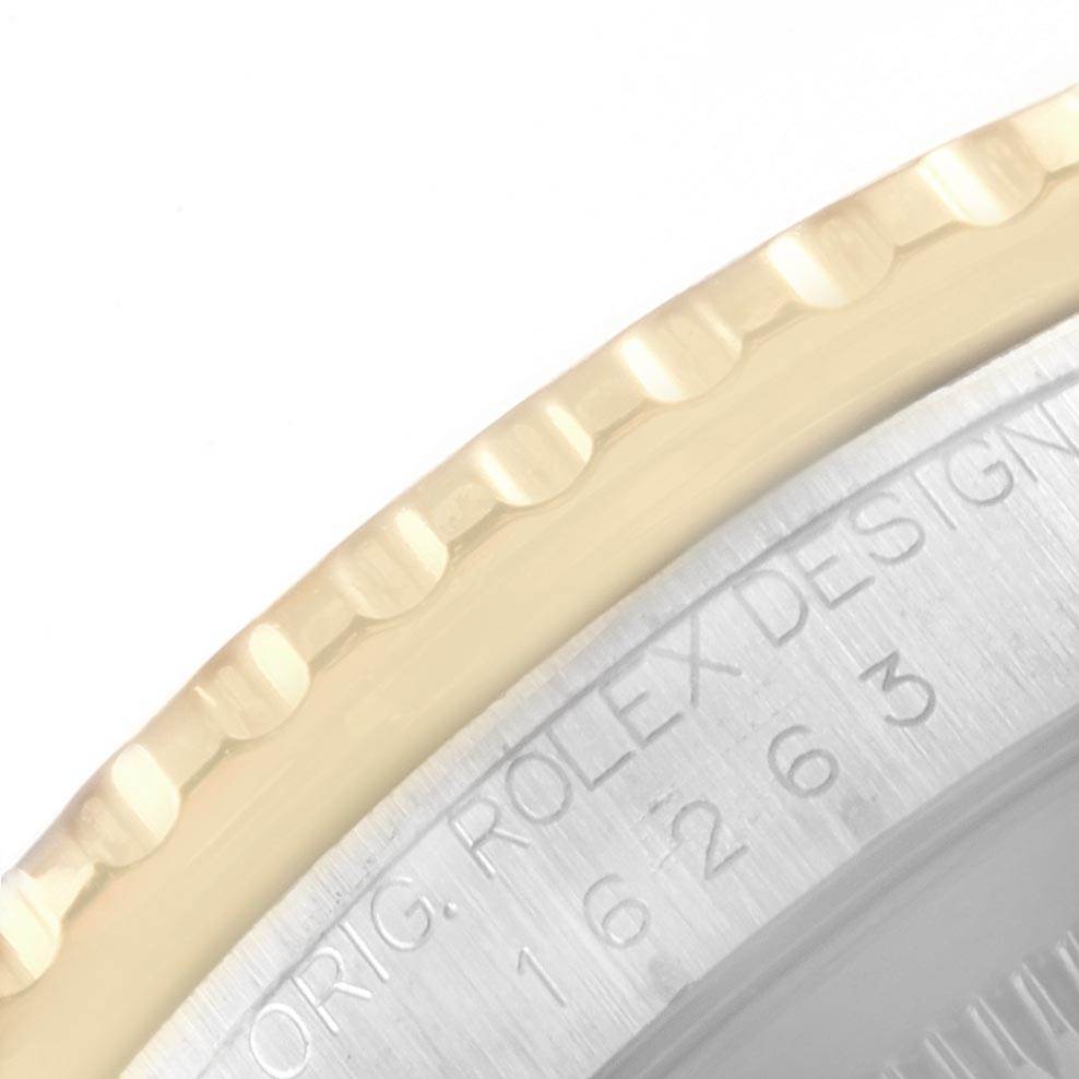 This close-up image shows the edge of the bezel and part of the case back engraving on a Rolex Turn-o-Graph 16263 Men's Steel and Gold (two tone) Blue Dial 16263 Men's Steel and Gold (two tone) Blue Dial watch.