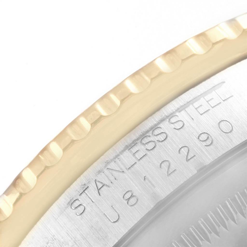 This image shows a close-up of the bezel edge and a portion of the case back with serial engraving of a Rolex Turn-o-Graph 16263 Men's Steel and Gold (two tone) Blue Dial 16263 Men's Steel and Gold (two tone) Blue Dial model.