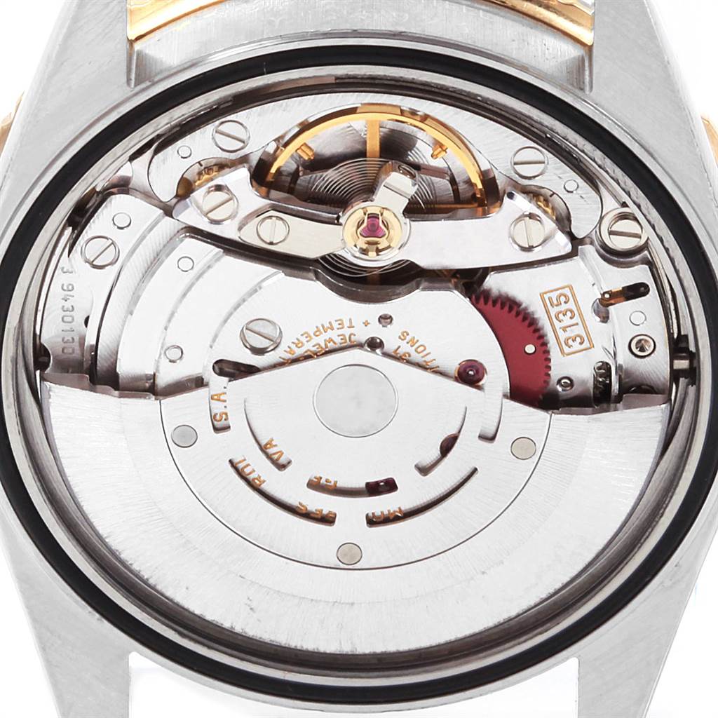 This image shows the movement and internal mechanisms of a Rolex Turn-o-Graph 16263 Men
s Steel and Gold (two tone) Champagne Dial 16263 Men
s Steel and Gold (two tone) Champagne Dial watch from a rear angle.