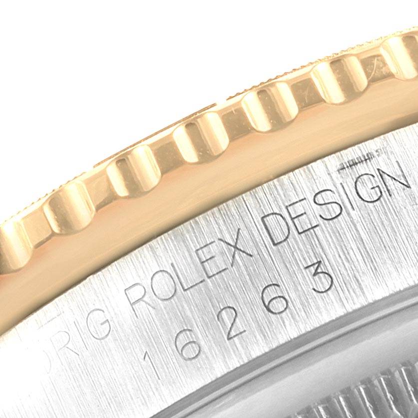 The image shows a close-up of the bezel and the engraved case side of a Rolex Turn-o-Graph 16263 Men
s Steel and Gold (two tone) Black Dial 16263 Men
s Steel and Gold (two tone) Black Dial model.