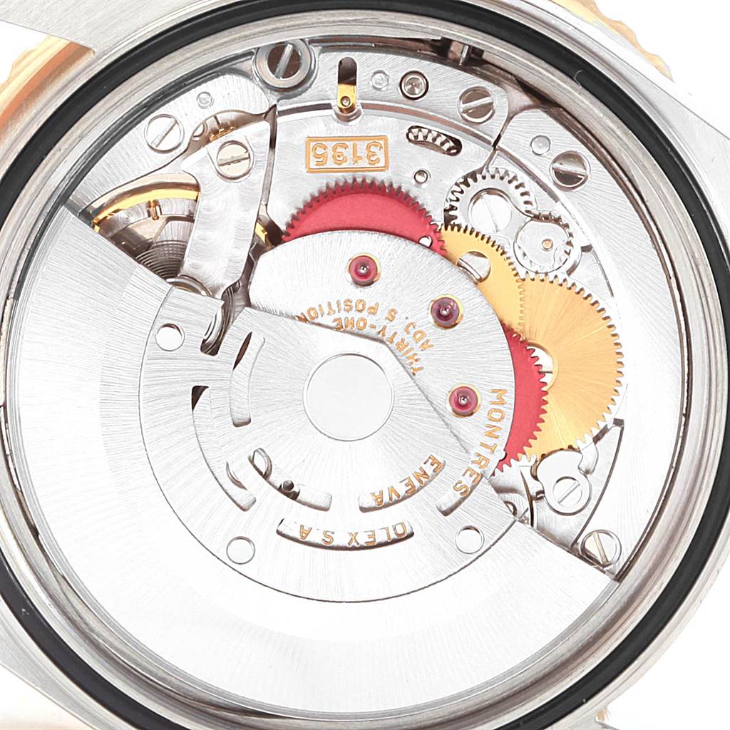 The image shows the internal mechanical movement, including gears and rotor, of a Rolex Turn-o-Graph 16263 Men
s Steel and Gold (two tone) Black Dial 16263 Men
s Steel and Gold (two tone) Black Dial watch from a rear angle.