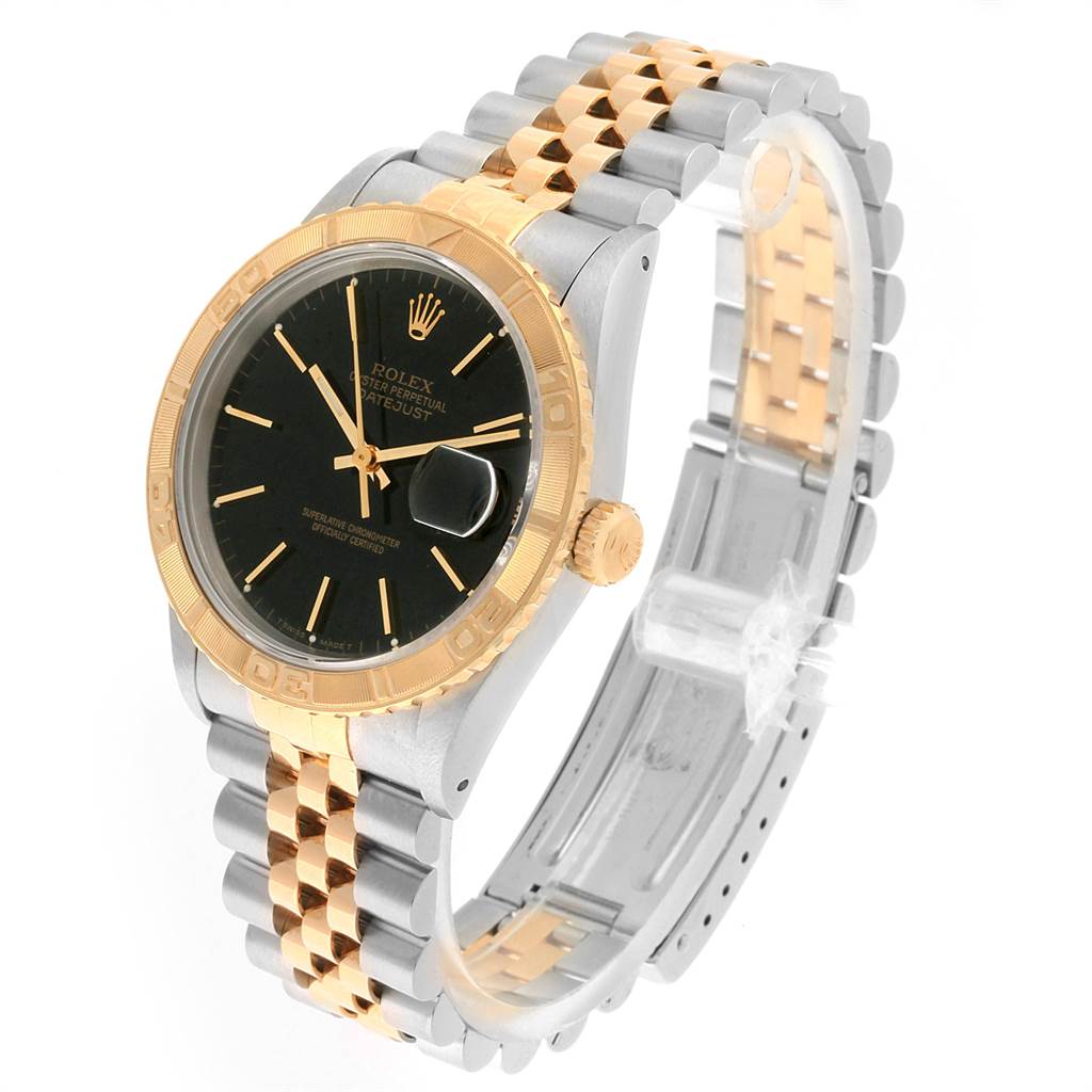 The Rolex Turn-o-Graph 16263 Men
s Steel and Gold (two tone) Black Dial 16263 Men
s Steel and Gold (two tone) Black Dial watch is shown at a three-quarter angle, highlighting the face, bezel, and band detail.
