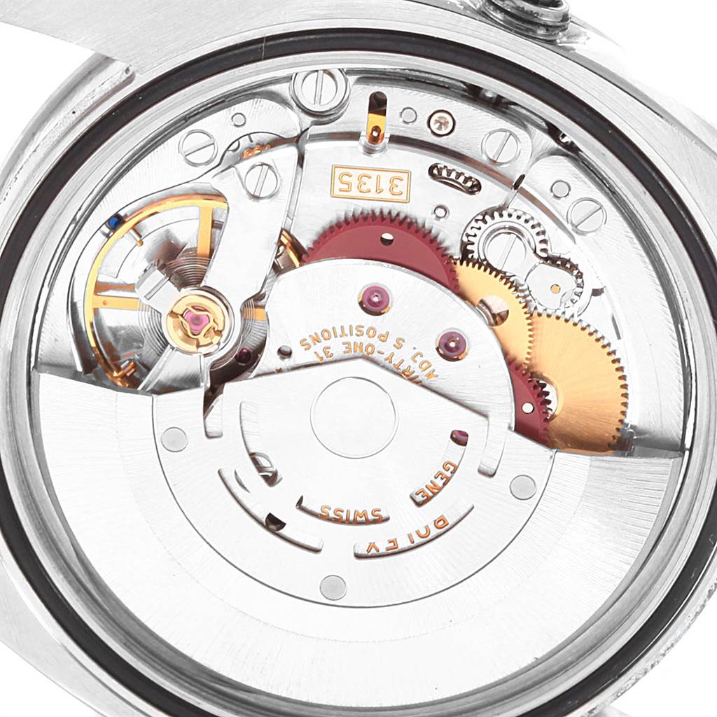 This image shows the movement of the Rolex Turn-o-Graph 116264 Men's Stainless Steel Black Dial 116264 Men's Stainless Steel Black Dial watch from a back angle with its intricate gears and components visible.