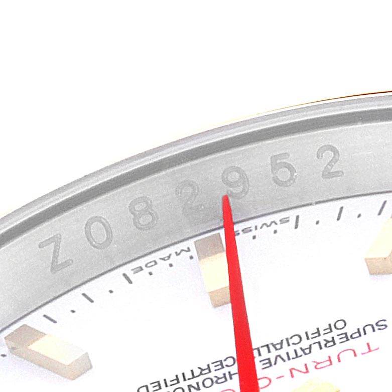 The image shows a partial view of the Rolex Turn-o-Graph 116263 Men's Steel and Gold (two tone) White Dial 116263 Men's Steel and Gold (two tone) White Dial watch face, featuring the edge of the dial and a portion of the bezel with engraved numbers.