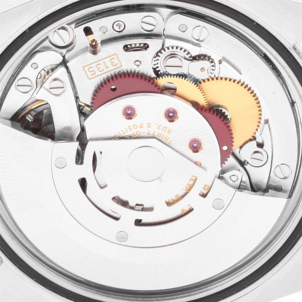 The image shows the internal movement and gears of a Rolex Turn-o-Graph 116264 Men
s Stainless Steel Blue Dial 116264 Men
s Stainless Steel Blue Dial watch.