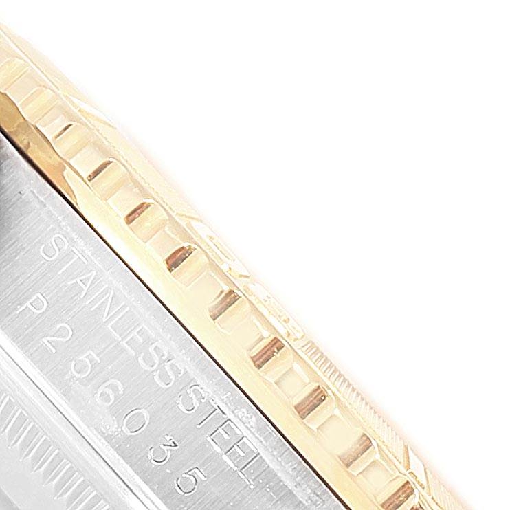 The image shows a close-up view of the Rolex Turn-o-Graph 16263 Men
s Steel and Gold (two tone) White Dial 16263 Men
s Steel and Gold (two tone) White Dial watch, featuring the edge of the bezel and part of the case with "STAINLESS STEEL" engraved.