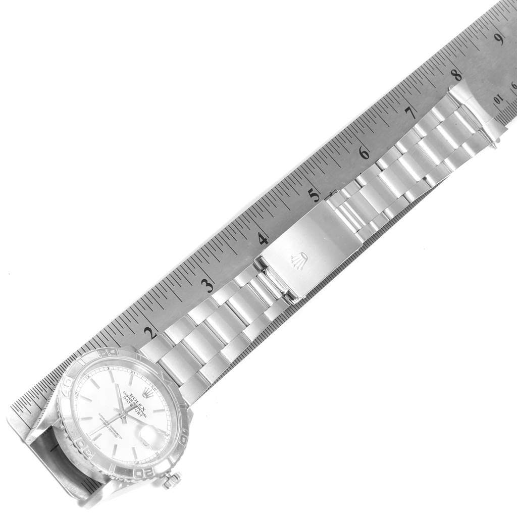 This image shows a Rolex Turn-o-Graph 16264 Men
s Stainless Steel White Dial 16264 Men
s Stainless Steel White Dial watch laid flat with its bracelet aligned to a ruler for measurement.