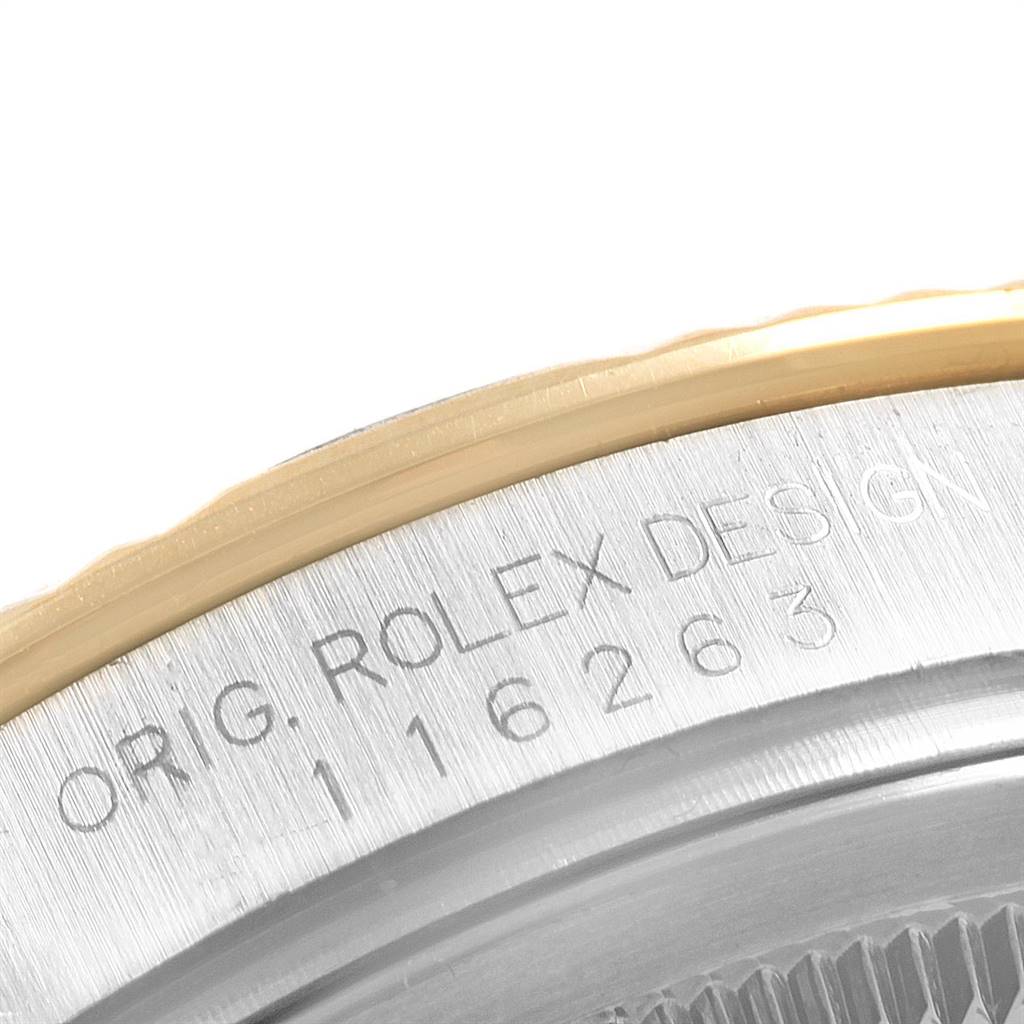 The image shows a close-up of the case back engraving for the Rolex Turn-o-Graph 116263 Men's Steel and Gold (two tone) White Dial 116263 Men's Steel and Gold (two tone) White Dial model, displaying the serial number and design details.