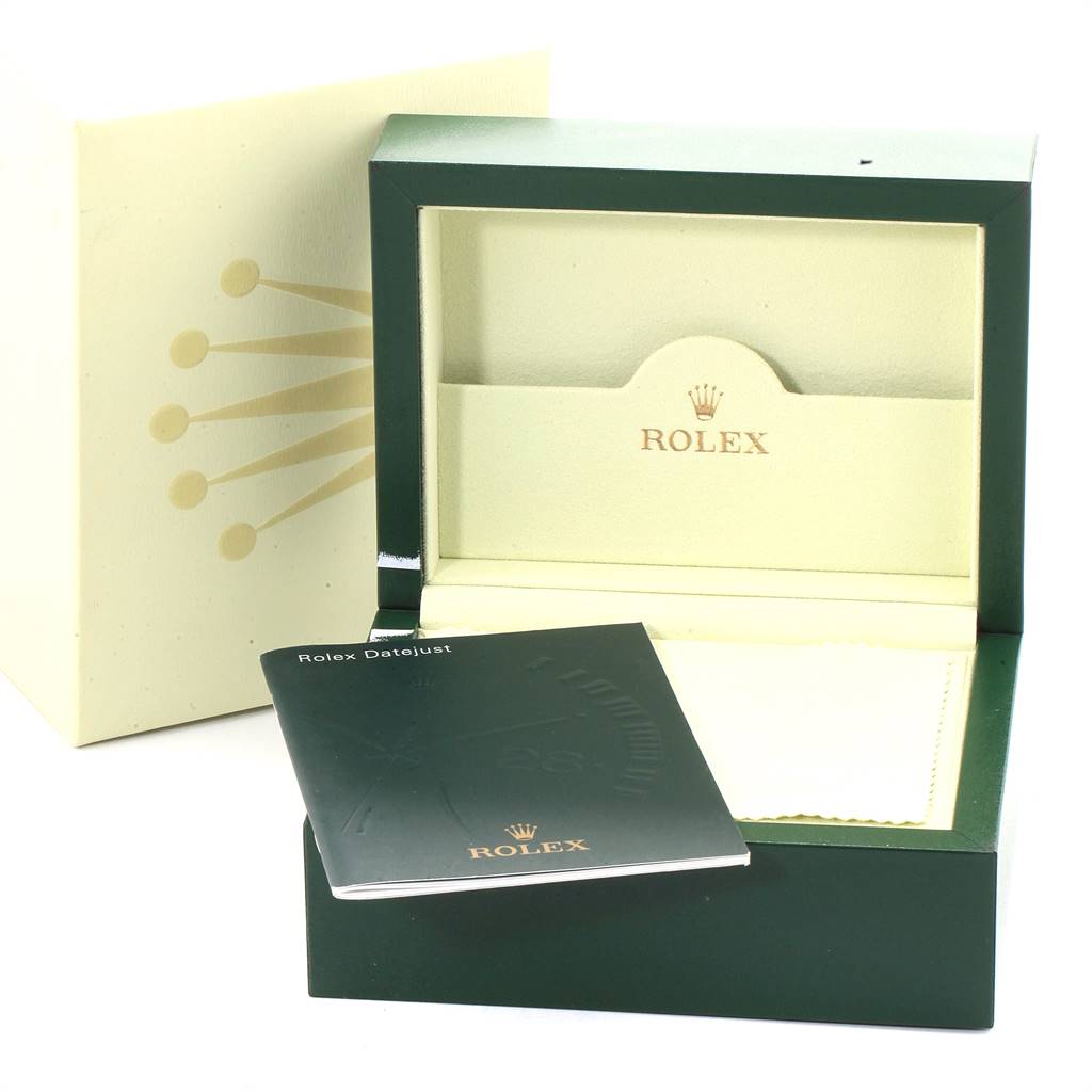 This image shows the packaging and accessories for a Rolex Turn-o-Graph 116263 Men's Steel and Gold (two tone) White Dial 116263 Men's Steel and Gold (two tone) White Dial, including the box, booklet, and cleaning cloth.