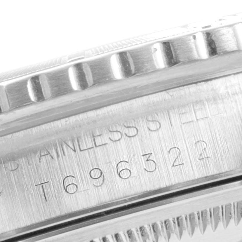 The image shows a close-up of the bezel and serial number engraving on a Rolex Turn-o-Graph 16264 Men
s Stainless Steel White Dial 16264 Men
s Stainless Steel White Dial watch.