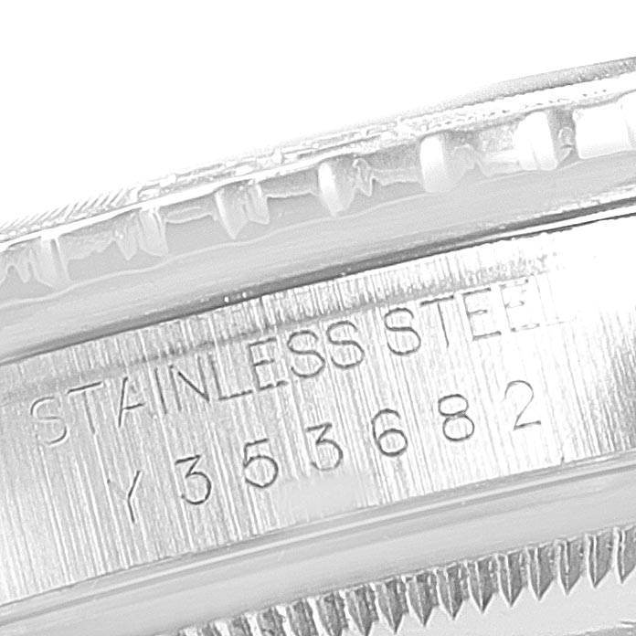 The image shows a close-up of the case side of a Rolex Turn-o-Graph 16264 Men's Stainless Steel Black Dial 16264 Men's Stainless Steel Black Dial watch, revealing part of the bezel and engraved serial number in stainless steel.