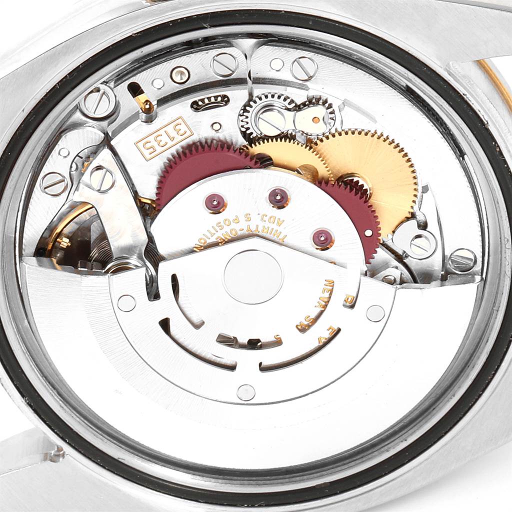 This image shows the internal mechanical movement components of a Rolex Turn-o-Graph 116263 Men
s Steel and Gold (two tone) Grey Dial 116263 Men
s Steel and Gold (two tone) Grey Dial watch from a back angle.