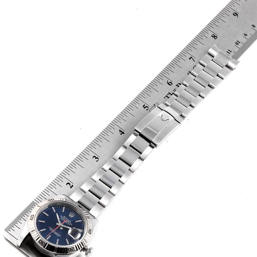 The image shows a Rolex Turn-o-Graph 116264 Men's Stainless Steel Blue Dial 116264 Men's Stainless Steel Blue Dial watch laid flat with a ruler for measurement, highlighting the watch face and bracelet.