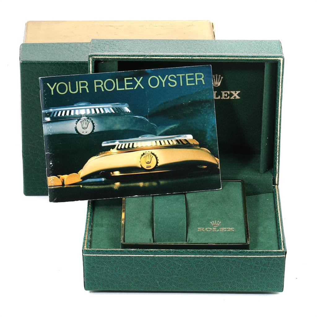 The image shows the box of a Rolex Turn-o-Graph 16258 Men
s Yellow Gold White Dial 16258 Men
s Yellow Gold White Dial, along with its booklet and insert.