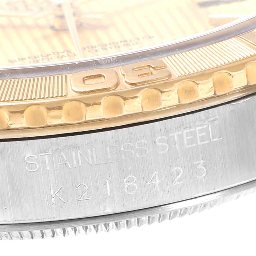 The image shows a close-up angle of the bezel and stainless steel case of the Rolex Turn-o-Graph 16263 Men
s Steel and Gold (two tone) Champagne Dial 16263 Men
s Steel and Gold (two tone) Champagne Dial watch, displaying part of the serial number.