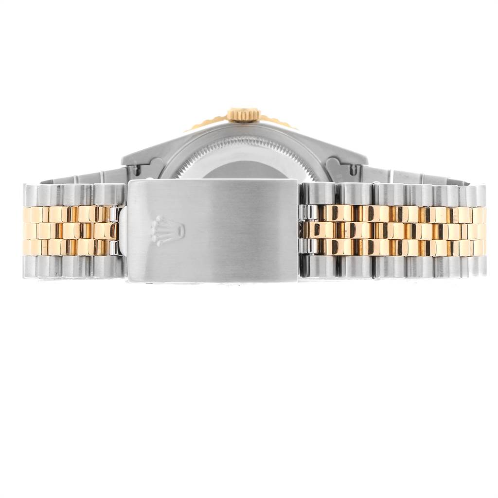 The image shows the clasp of the bracelet on a Rolex Turn-o-Graph 16263 Men
s Steel and Gold (two tone) Champagne Dial 16263 Men
s Steel and Gold (two tone) Champagne Dial watch, viewed from the back.