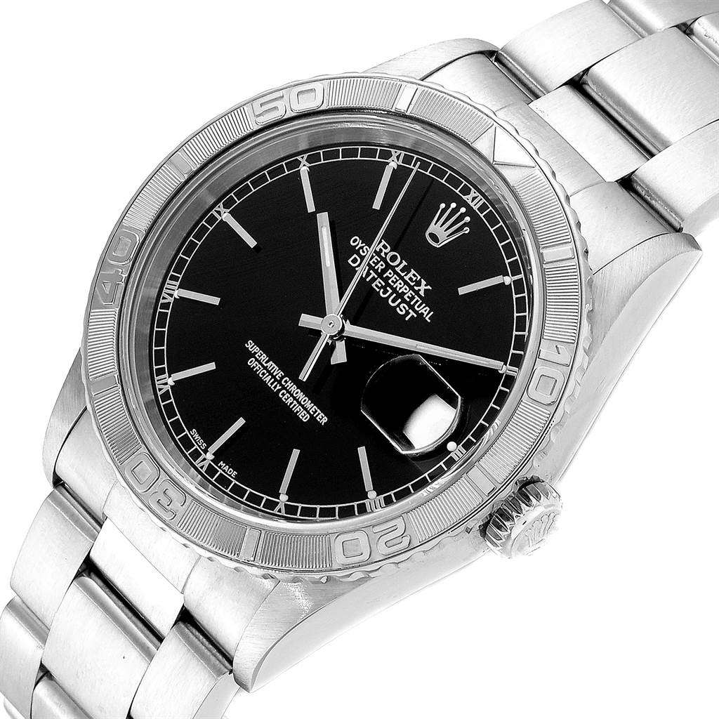 This image shows a close-up of the dial, bezel, and bracelet of a Rolex Turn-o-Graph 16264 Men's Stainless Steel Black Dial 16264 Men's Stainless Steel Black Dial watch, showcasing its black face and metal links.