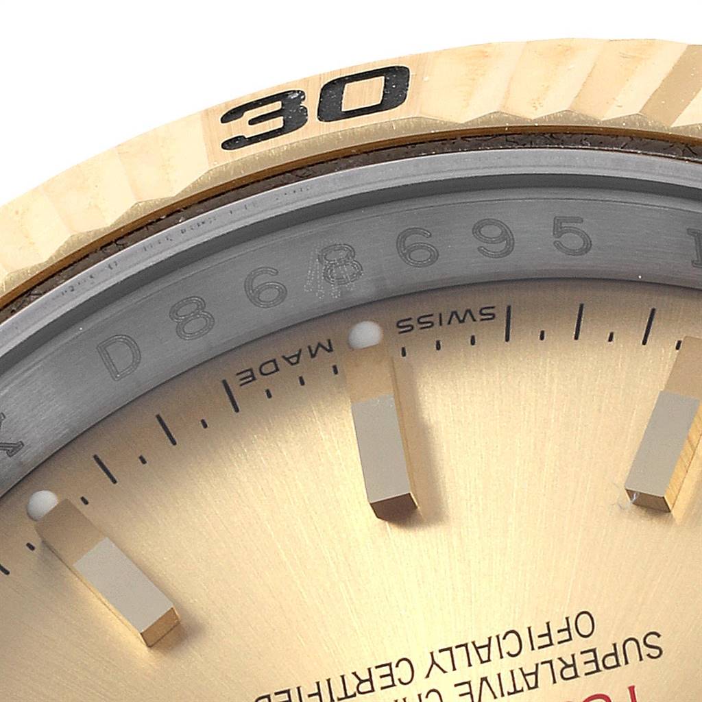 The image shows a close-up of the dial, bezel, and markers of the Rolex Turn-o-Graph 116263 Men
s Stainless Steel Champagne Dial 116263 Men
s Stainless Steel Champagne Dial watch, focusing on the markers around 11 to 5 o
clock positions.