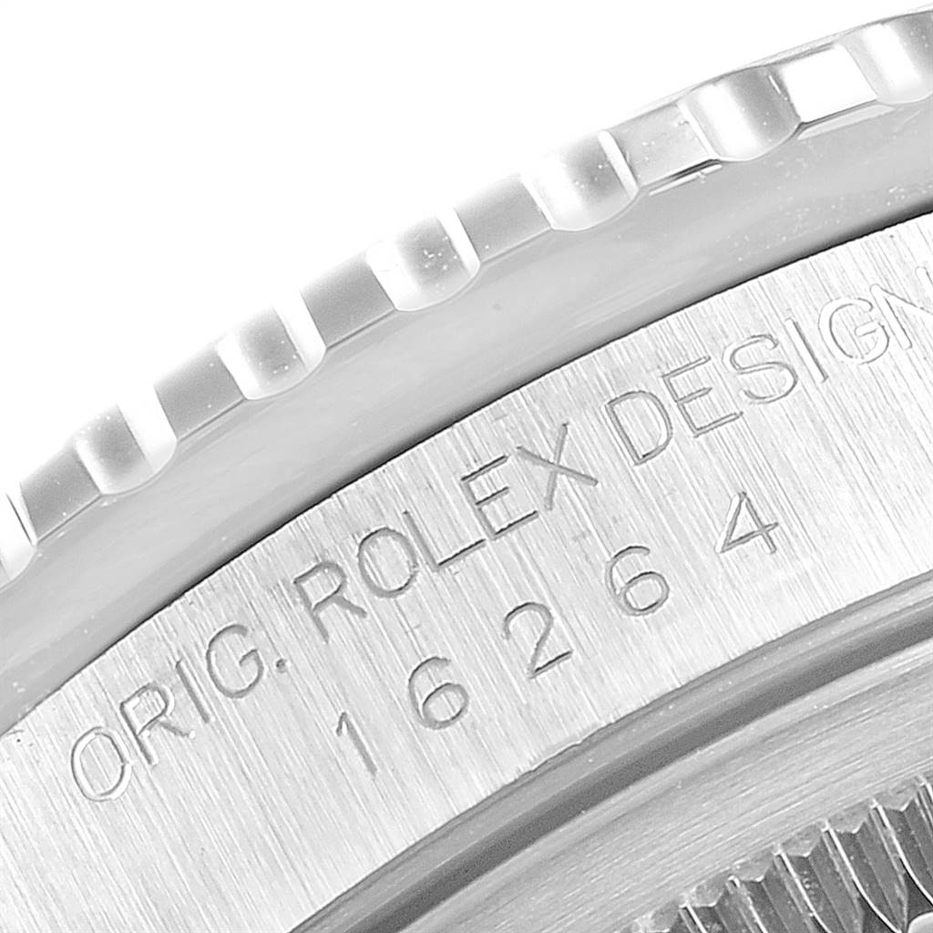 The image shows a close-up of the bezel and part of the case of a Rolex Turn-o-Graph 16264 Men
s Stainless Steel White Dial 16264 Men
s Stainless Steel White Dial watch with model number 16264 engraved.