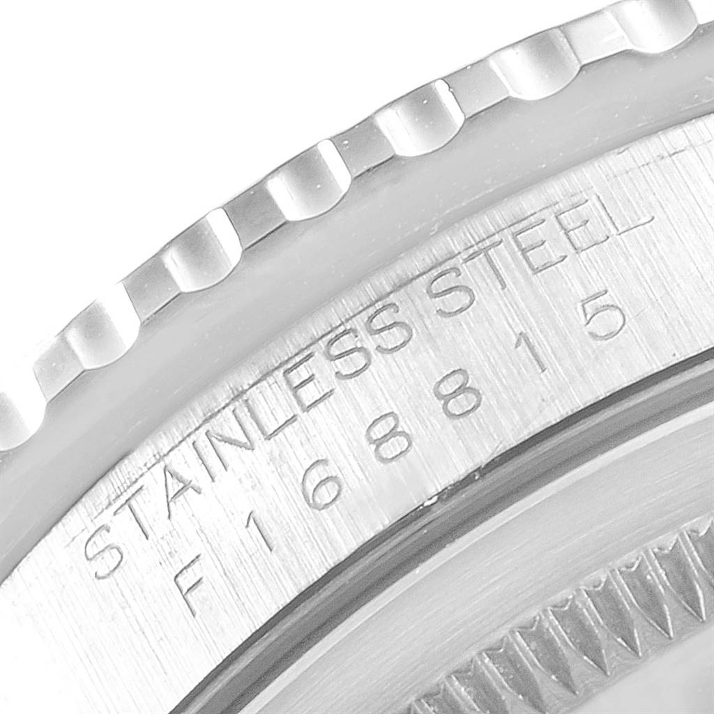 This image shows a close-up of the stainless steel casing and part of the bezel of the Rolex Turn-o-Graph 16264 Men
s Stainless Steel White Dial 16264 Men
s Stainless Steel White Dial watch, including some engraved serial numbers.