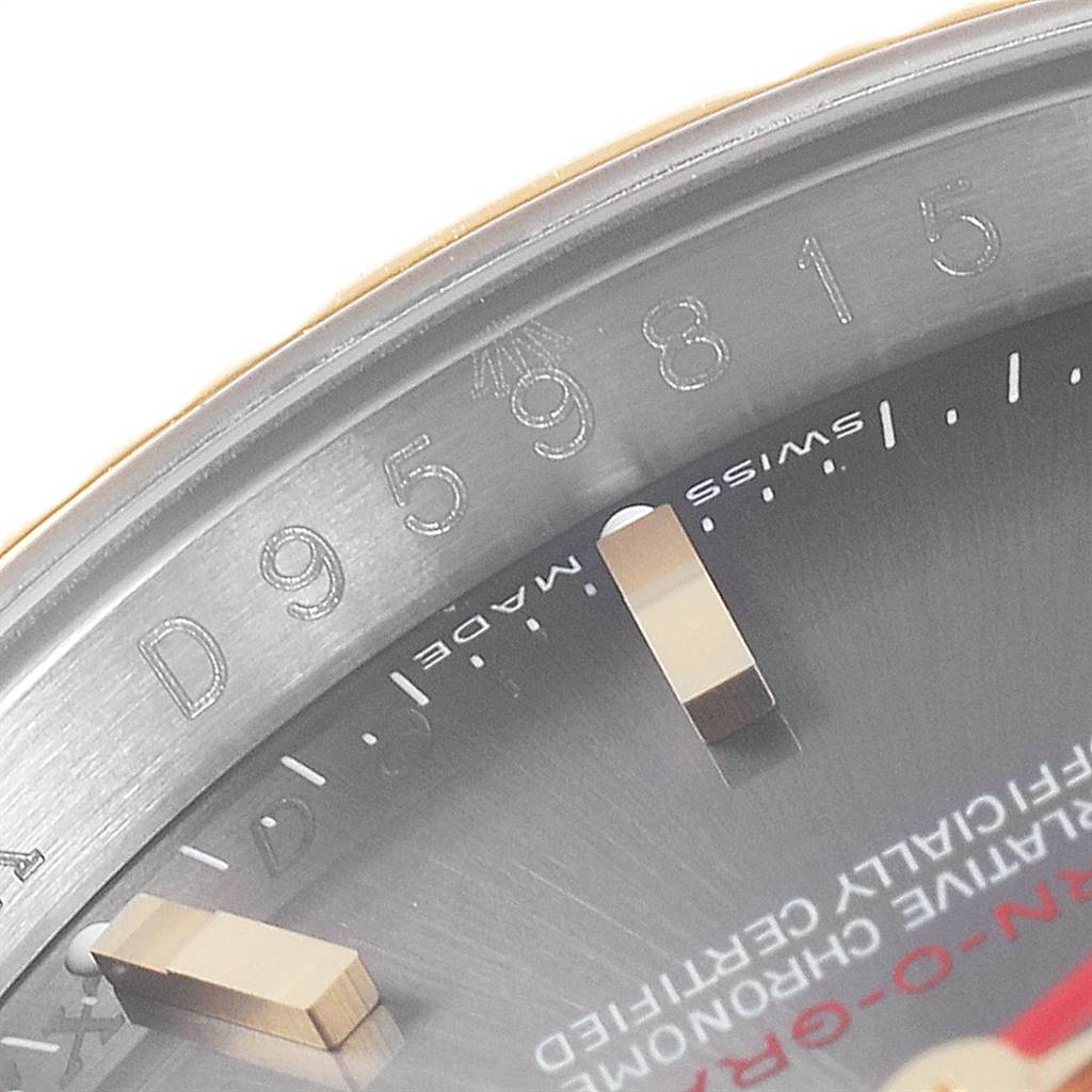 The image shows a close-up of the dial and engraved serial number on a Rolex Turn-o-Graph 116263 Men
s Steel and Gold (two tone) Grey Dial 116263 Men
s Steel and Gold (two tone) Grey Dial watch.