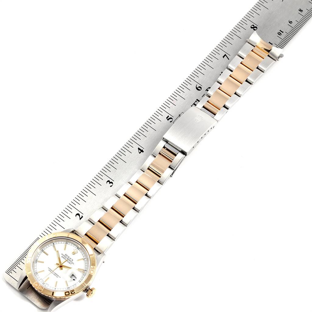 The image shows a Rolex Turn-o-Graph 16263 Men
s Steel and Gold (two tone) White Dial 16263 Men
s Steel and Gold (two tone) White Dial watch and its band, laid flat with a ruler for measurement.