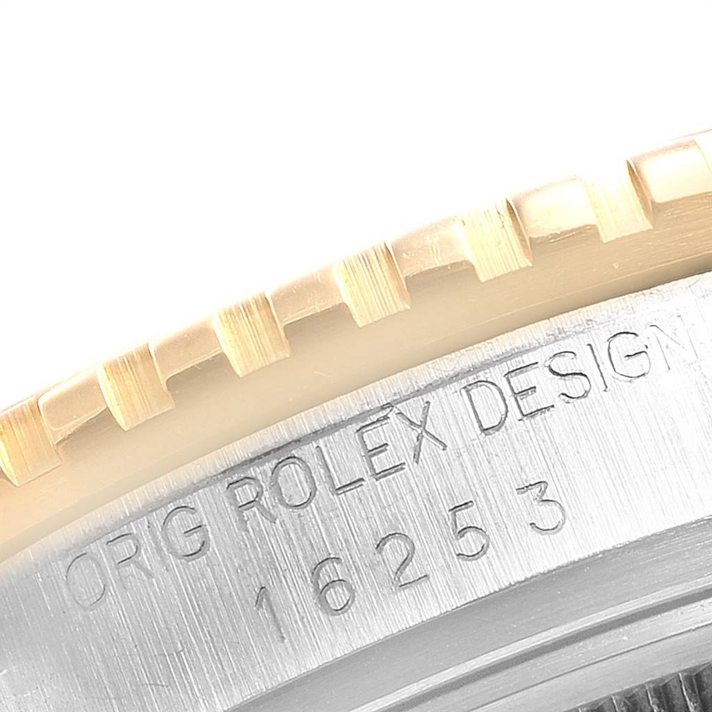 This close-up angle shows the bezel and case of the Rolex Turn-o-Graph 16253 Men
s Steel and Gold (two tone) Blue Dial 16253 Men
s Steel and Gold (two tone) Blue Dial model, highlighting the engraved model number and brand.