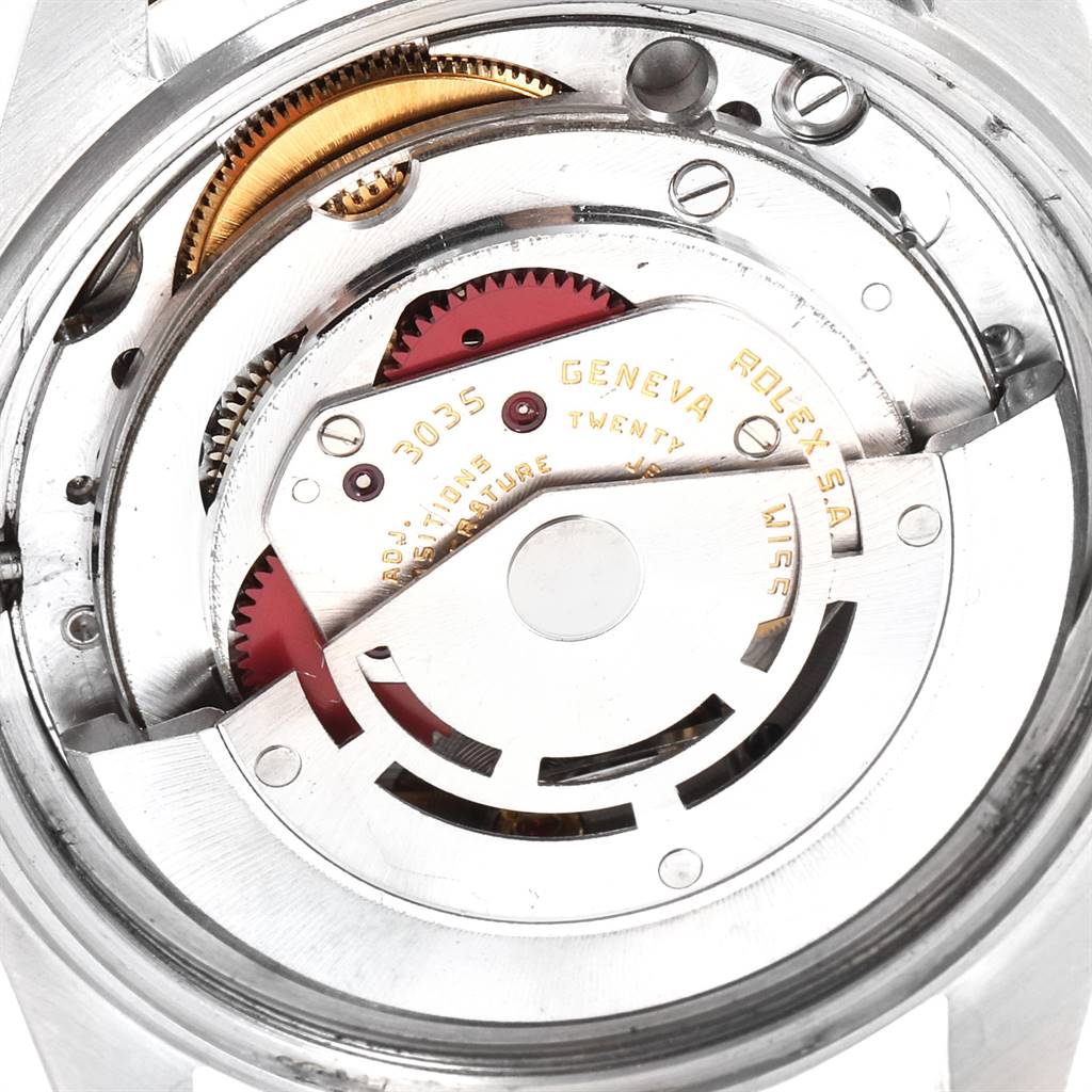 The image shows the internal movement mechanism of a Rolex Turn-o-Graph 16253 Men
s Steel and Gold (two tone) Blue Dial 16253 Men
s Steel and Gold (two tone) Blue Dial watch, highlighting gears and the rotor.