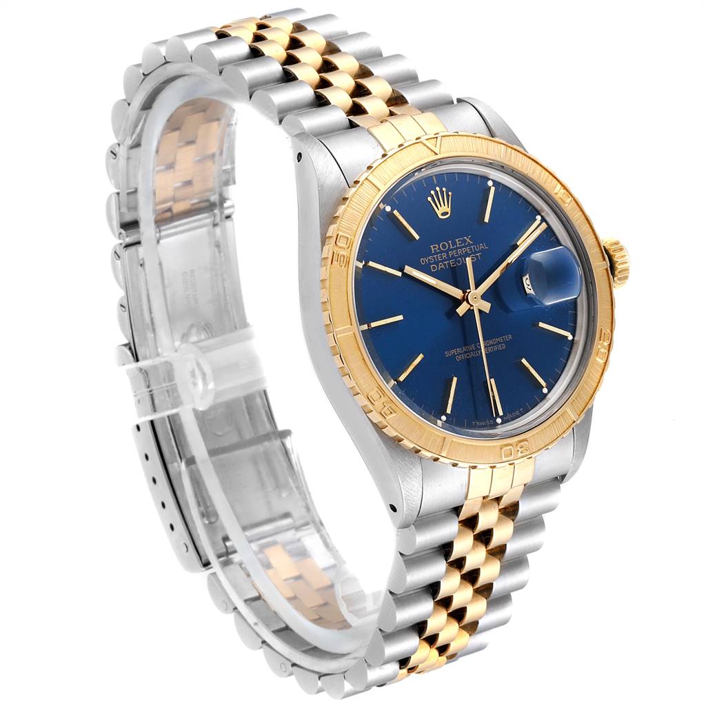 This image shows a side angle of a Rolex Turn-o-Graph 16253 Men
s Steel and Gold (two tone) Blue Dial 16253 Men
s Steel and Gold (two tone) Blue Dial watch, detailing the blue dial, gold bezel, and two-tone metal bracelet.