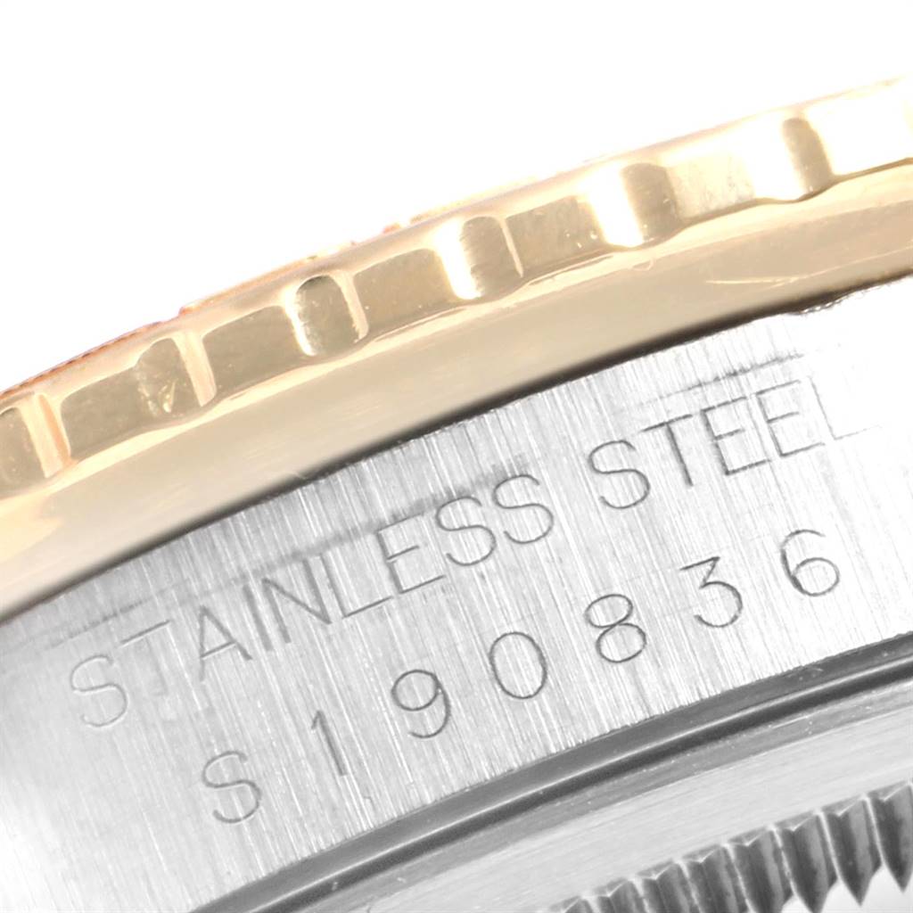 This image shows a close-up of the bezel and the side of the case of a Rolex Turn-o-Graph 16263 Men's Steel and Gold (two tone) White Dial 16263 Men's Steel and Gold (two tone) White Dial, highlighting the "Stainless Steel" engraving.