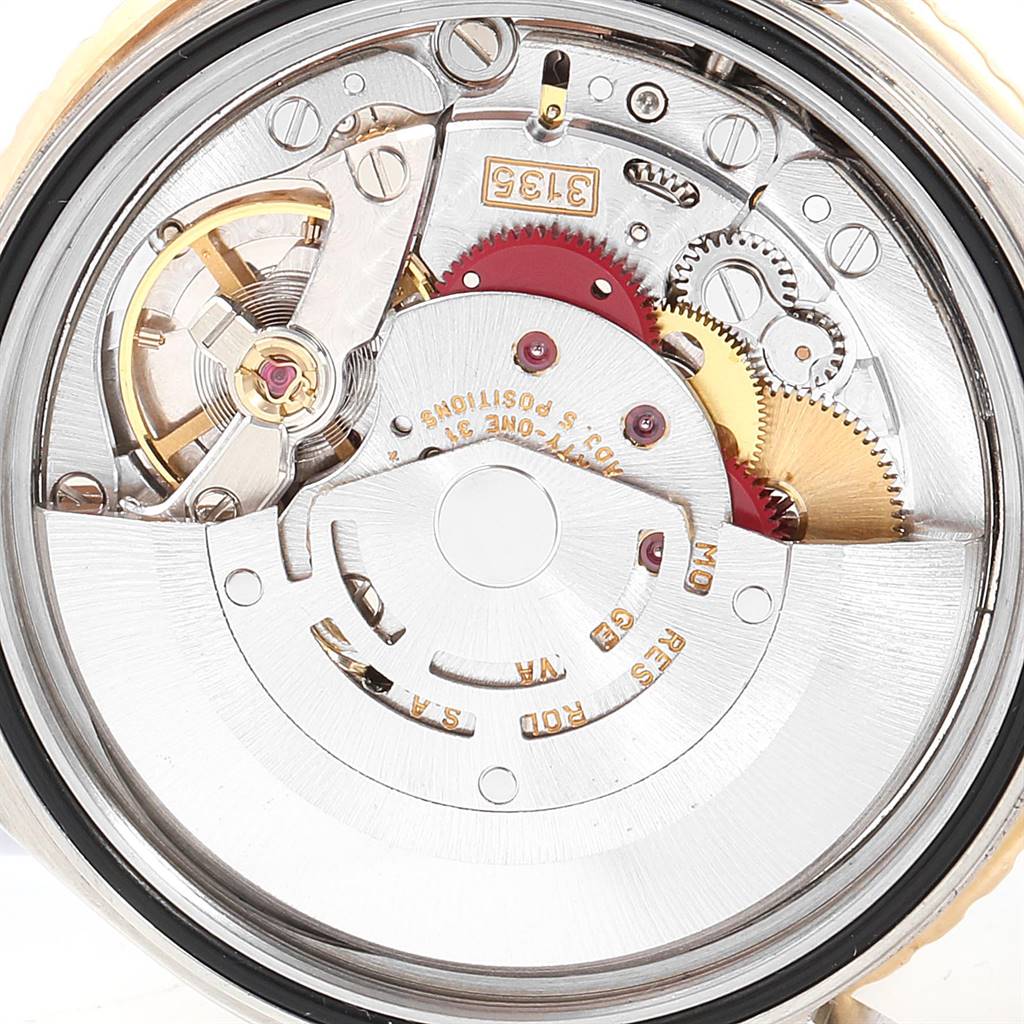 The image shows the internal mechanism of the Rolex Turn-o-Graph 16263 Men's Steel and Gold (two tone) White Dial 16263 Men's Steel and Gold (two tone) White Dial watch, including gears and the oscillating weight, from a top-down angle.