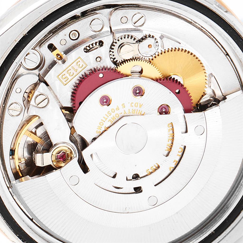 This is a close-up view of the internal mechanism of a Rolex Turn-o-Graph 116261 Men's Stainless Steel White Dial 116261 Men's Stainless Steel White Dial watch, showcasing its gears and components.