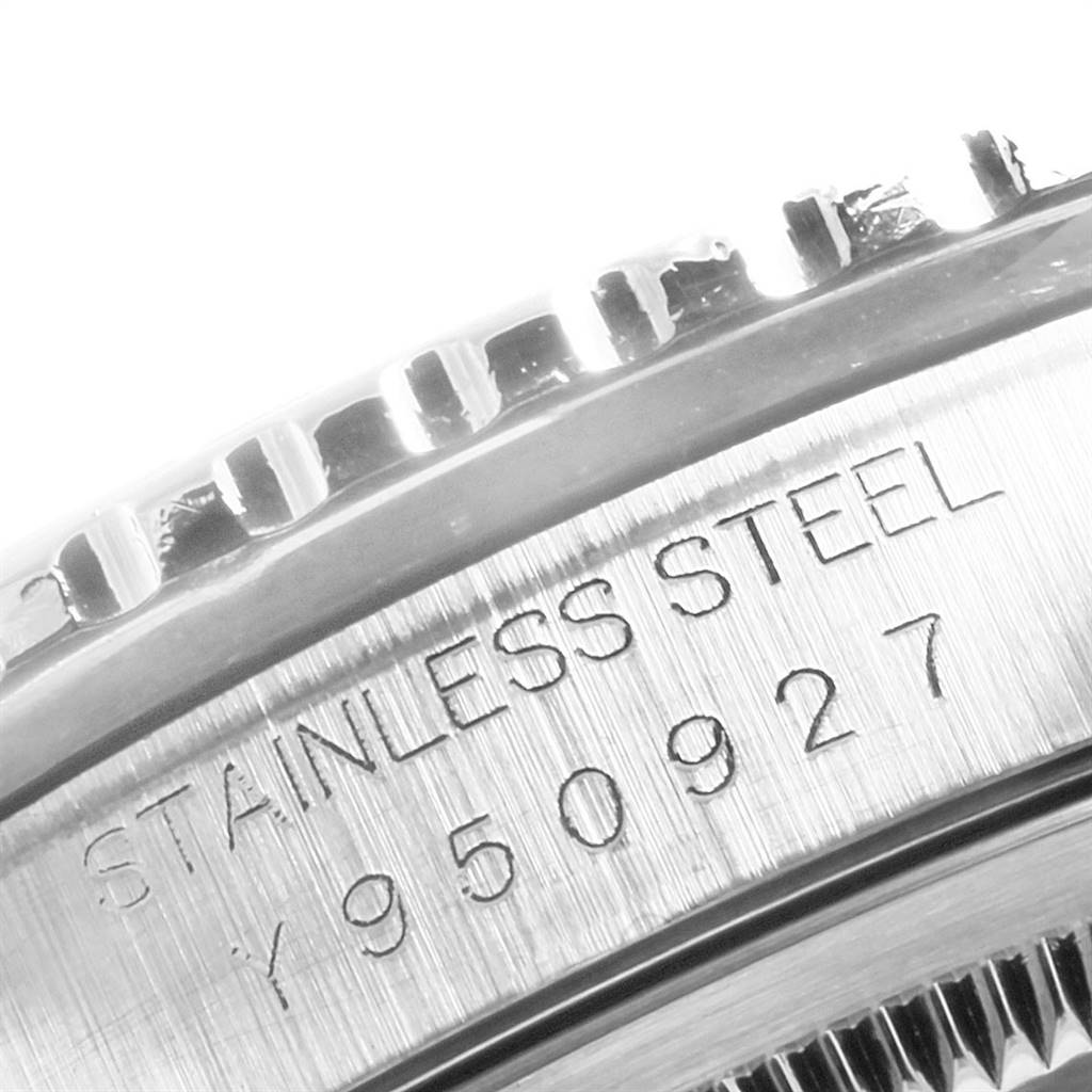 This close-up image shows the stainless steel case and serial number engraving of a Rolex Turn-o-Graph 16264 Men
s Stainless Steel Blue Dial 16264 Men
s Stainless Steel Blue Dial watch.