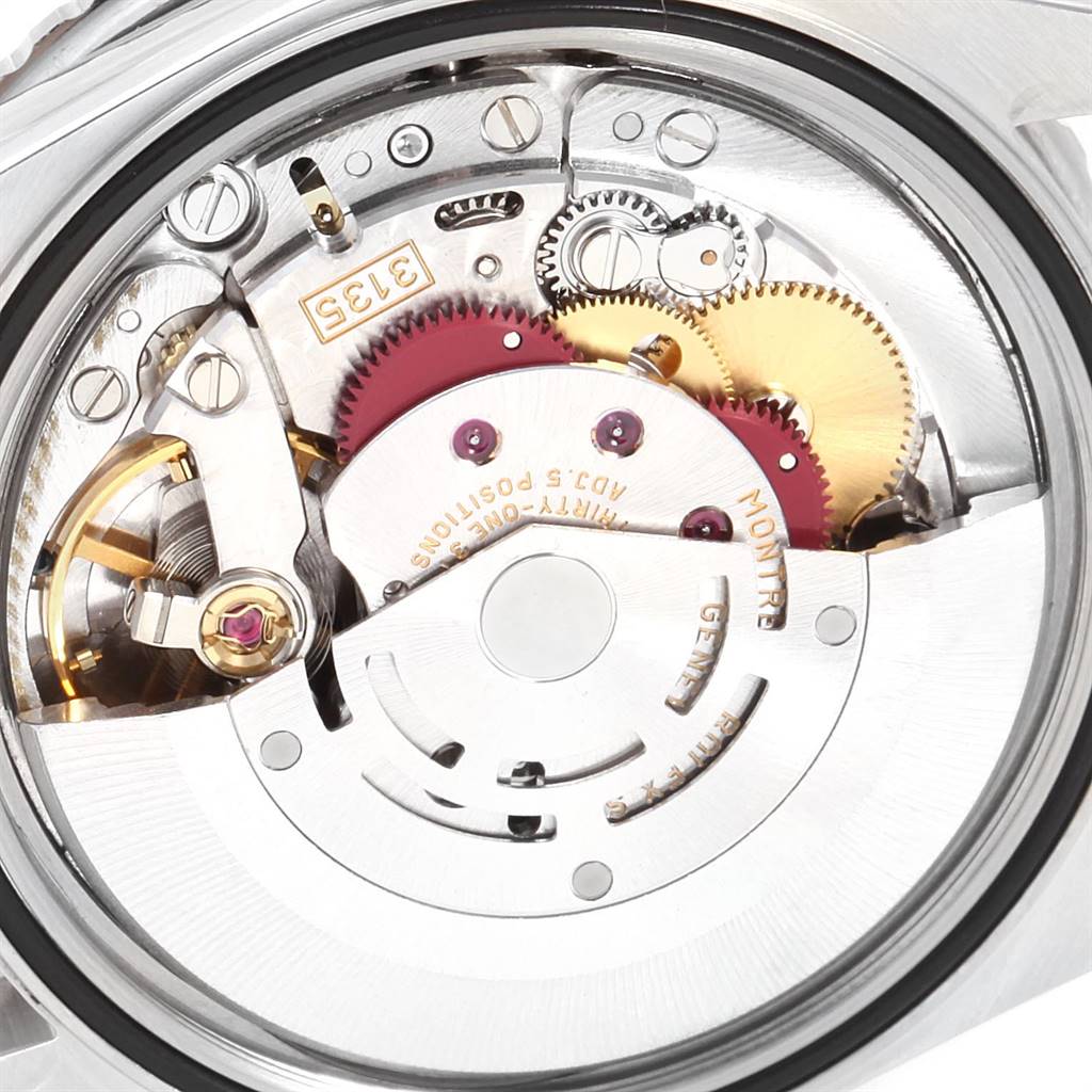 The image shows a close-up view of the movement mechanism of the Rolex Turn-o-Graph 16264 Men
s Stainless Steel Blue Dial 16264 Men
s Stainless Steel Blue Dial watch, including gears and jewels.