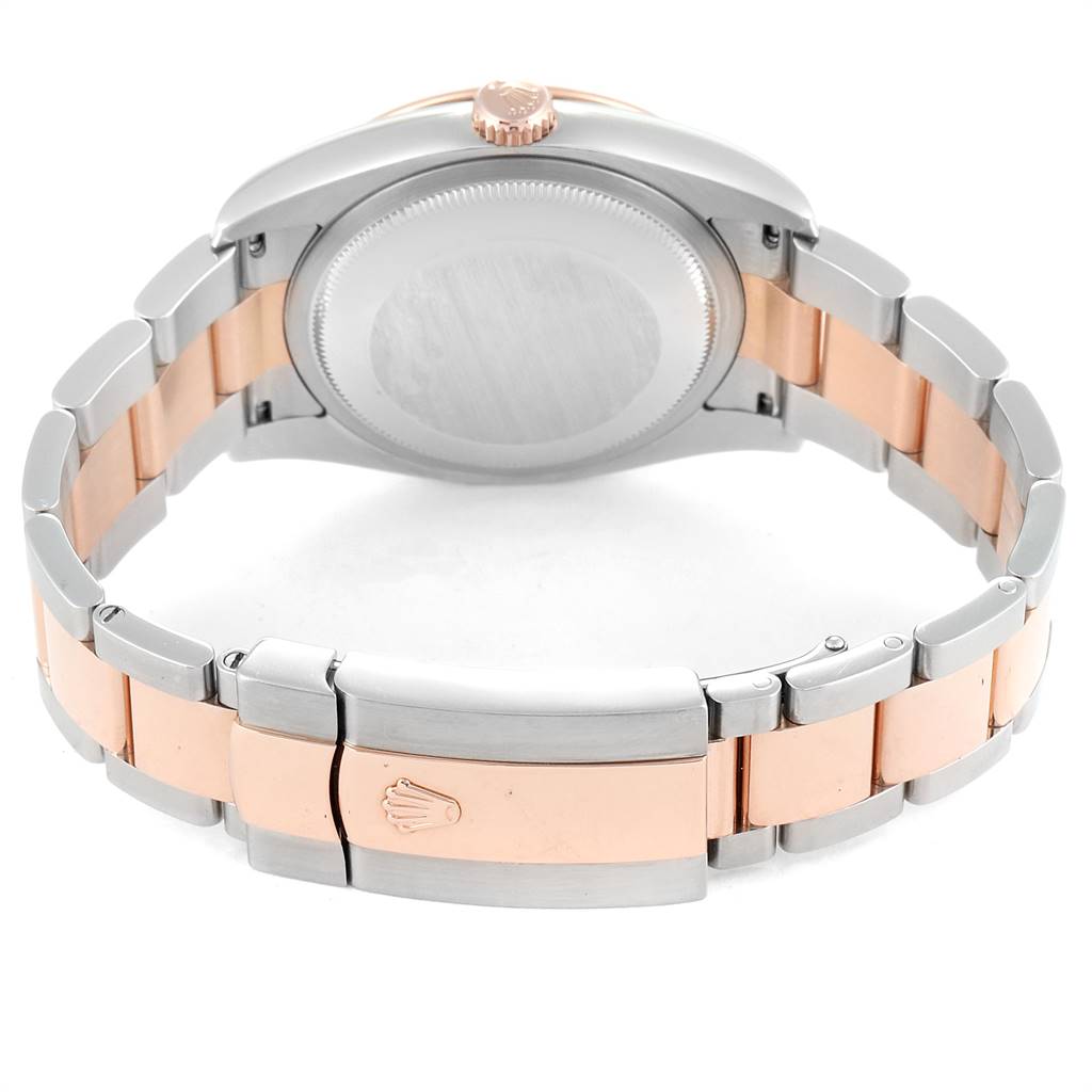 The image shows the back view of a Rolex Turn-o-Graph 116261 Men's Steel and Gold (two tone) Black Dial 116261 Men's Steel and Gold (two tone) Black Dial watch, highlighting its case, crown, and two-tone bracelet with the clasp.