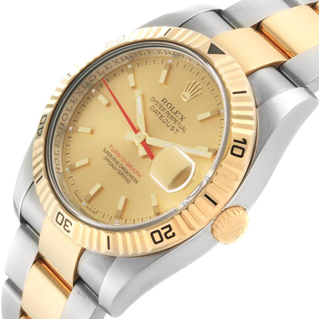 The image shows a close-up angle of the Rolex Turn-o-Graph 116263 Men
s Steel and Gold (two tone) Champagne Dial 116263 Men
s Steel and Gold (two tone) Champagne Dial watch, highlighting the dial, bezel, and part of the bracelet.