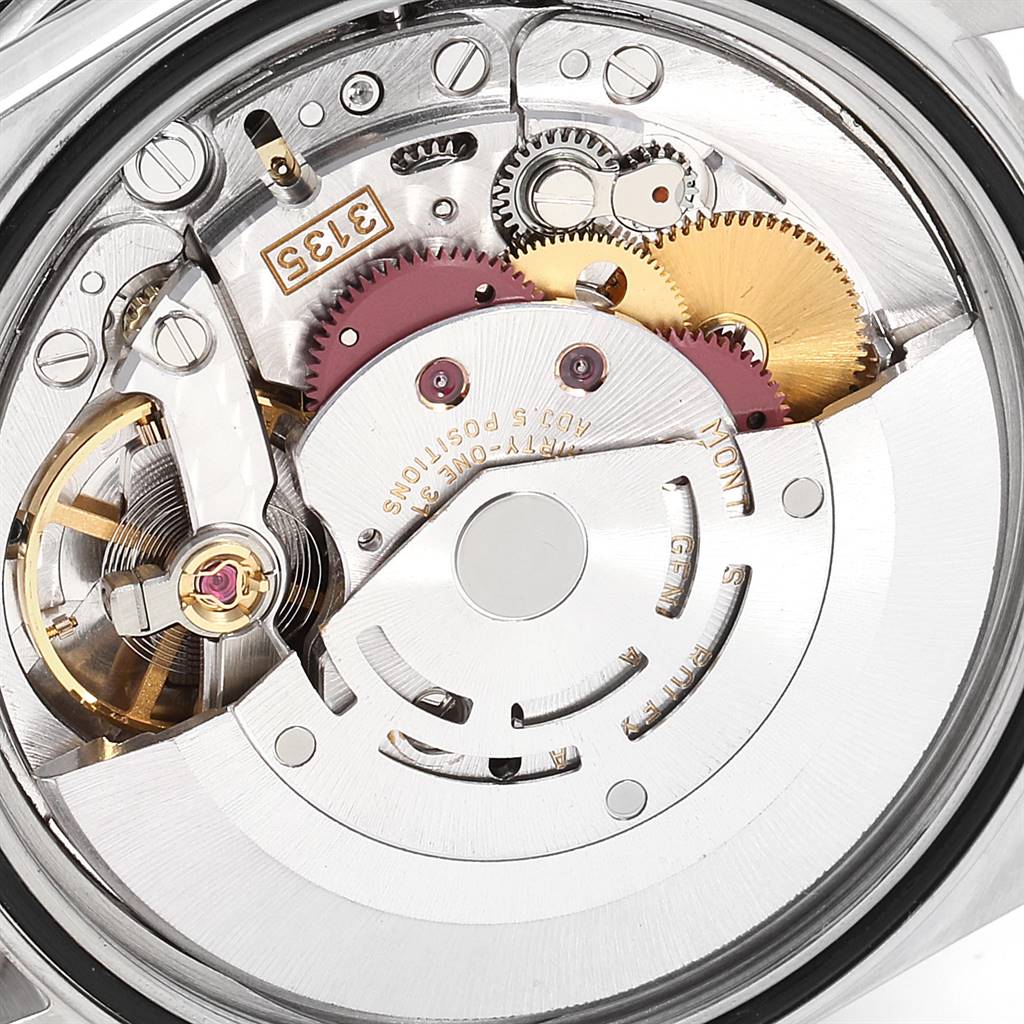 The image shows a close-up view of the movement mechanism of a Rolex Turn-o-Graph 16264 Men
s Stainless Steel Silver Dial 16264 Men
s Stainless Steel Silver Dial watch, highlighting gears and internal components.