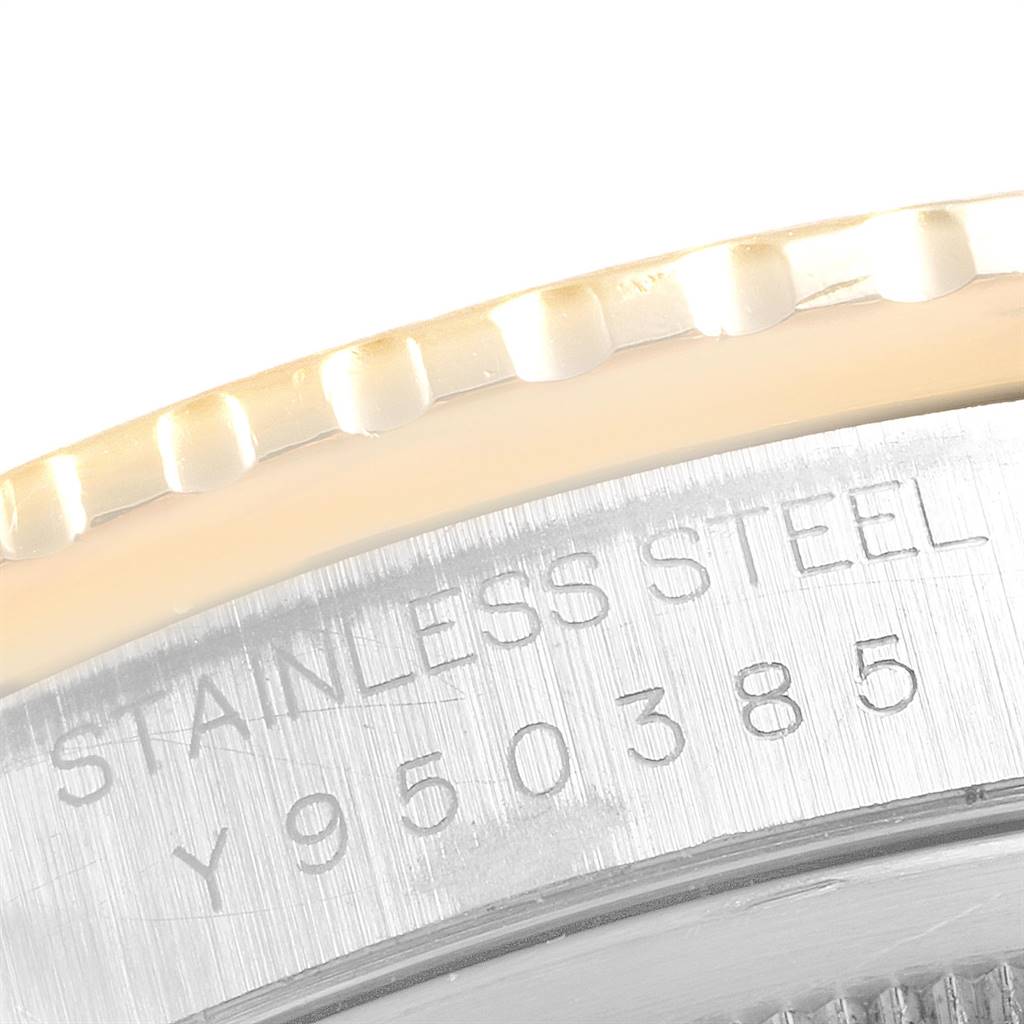 The close-up angle of the Rolex Turn-o-Graph 16263 Men
s Steel and Gold (two tone) Grey Dial 16263 Men
s Steel and Gold (two tone) Grey Dial watch displays part of its stainless steel case with serial numbers engraved.