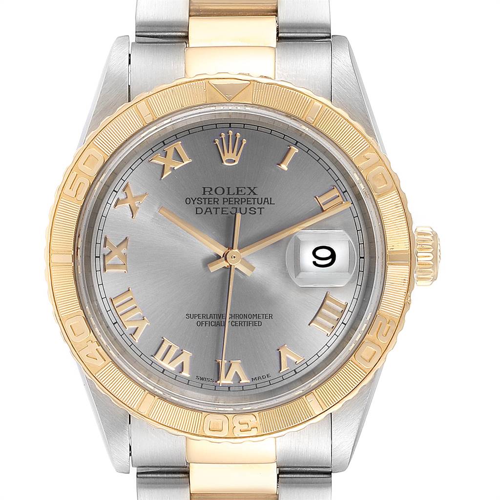 This Rolex Turn-o-Graph 16263 Men
s Steel and Gold (two tone) Grey Dial 16263 Men
s Steel and Gold (two tone) Grey Dial model is shown from a front angle, displaying its face, bezel, and part of the bracelet.