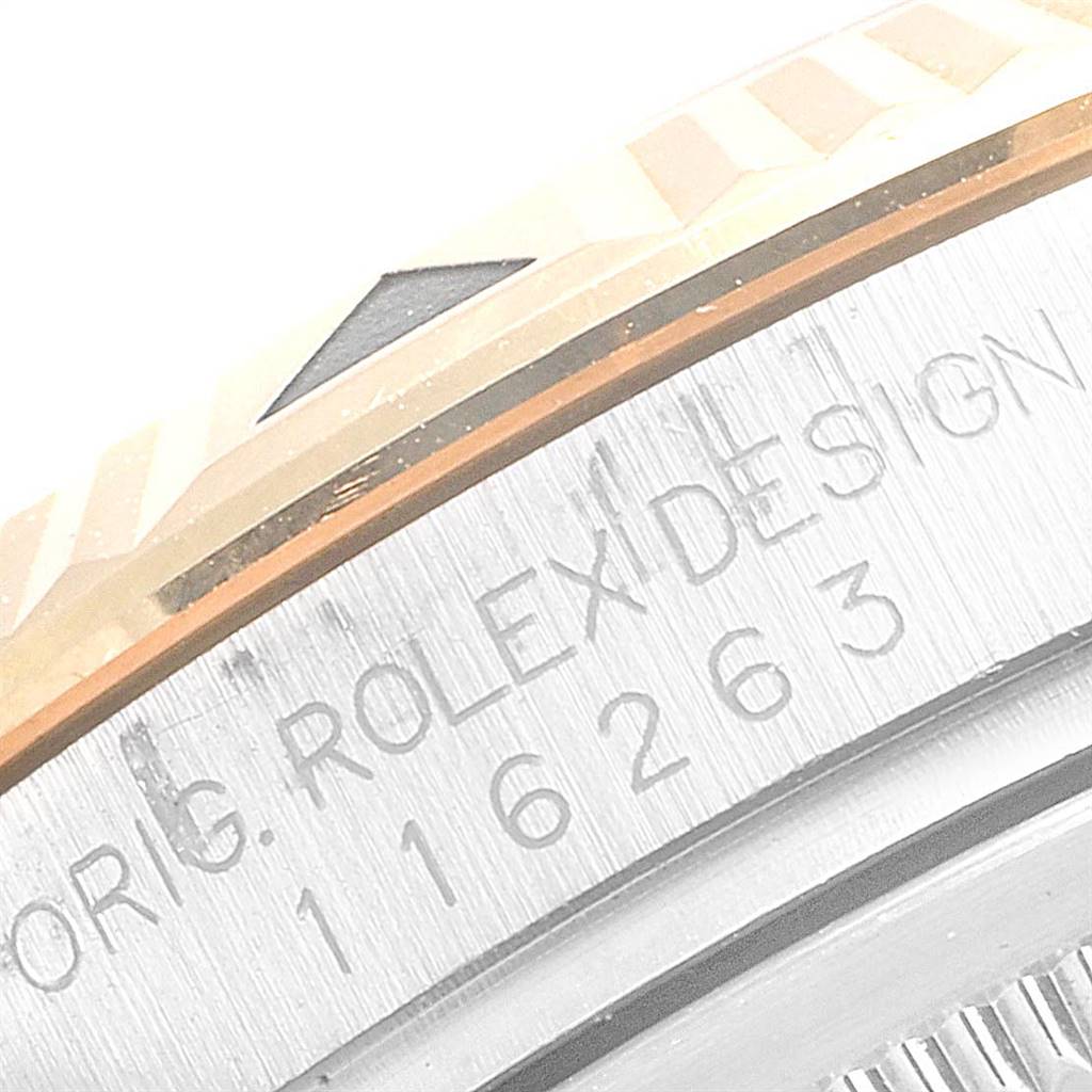 The image shows a close-up of the bezel and case edge of a Rolex Turn-o-Graph 116263 Men
s Stainless Steel White Dial 116263 Men
s Stainless Steel White Dial watch, featuring engraved text and part of the design.