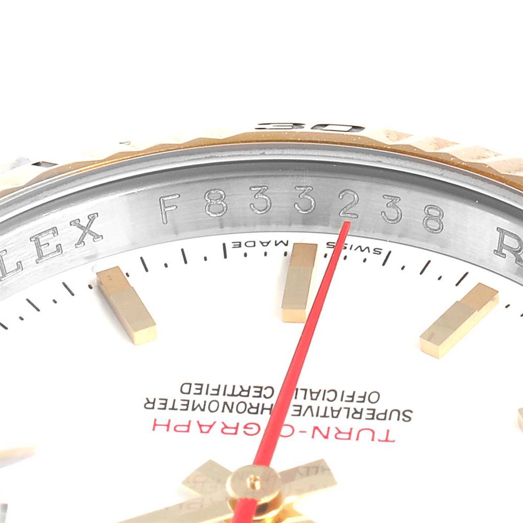 This image shows a close-up angle of the dial and part of the bezel of a Rolex Turn-o-Graph 116263 Men
s Stainless Steel White Dial 116263 Men
s Stainless Steel White Dial watch, focusing on the serial number and markers.