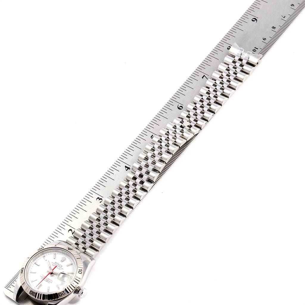 The image shows a Rolex Turn-o-Graph 116264 Men
s Stainless Steel White Dial 116264 Men
s Stainless Steel White Dial watch laid flat, alongside a ruler with the entire bracelet and dial visible.